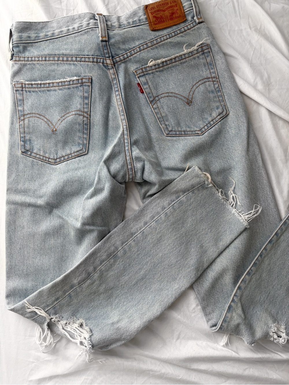 Levi's Light Wash Straight Leg Jeans with Frayed Hems